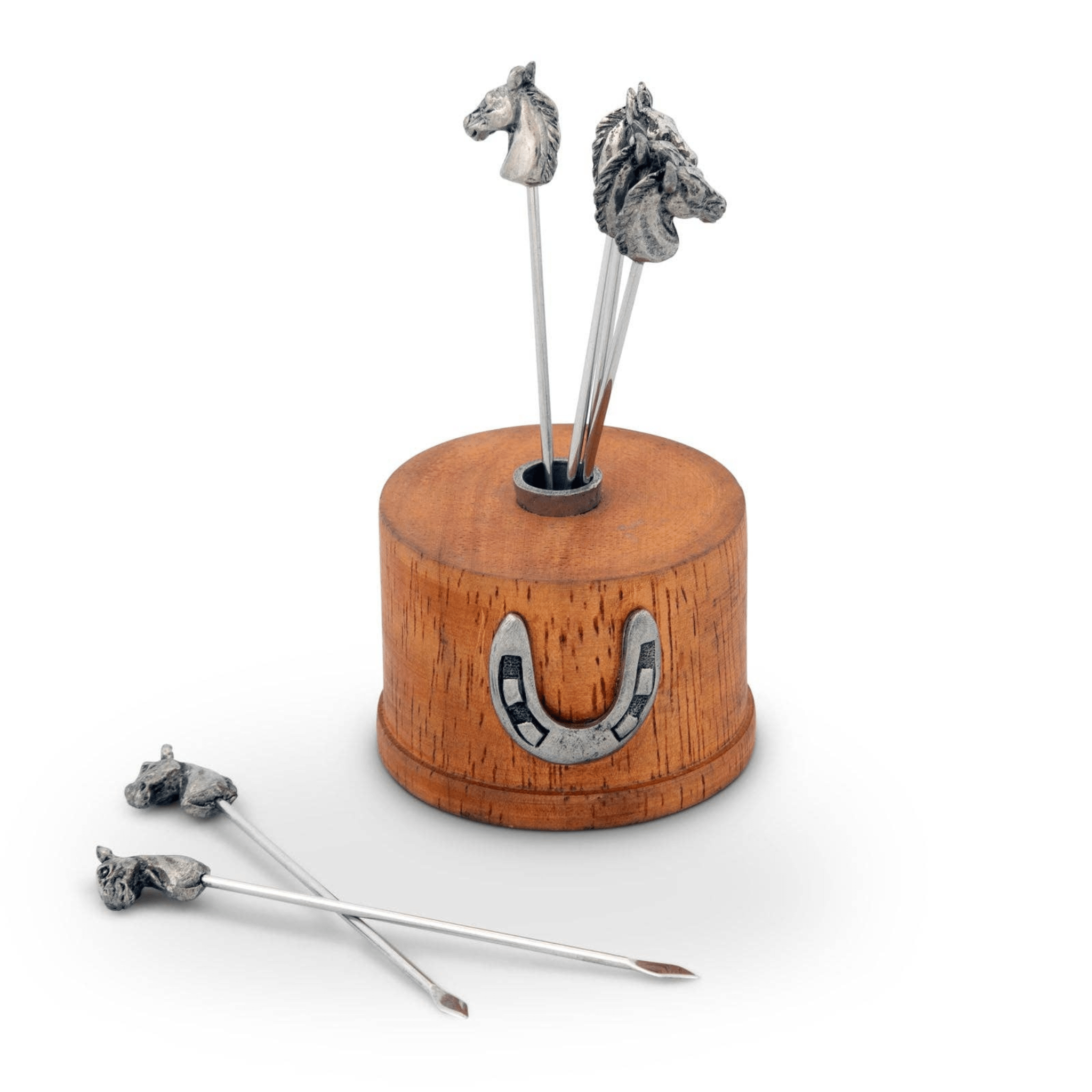 Wooden holder with metal horse-shaped skewers on a white background