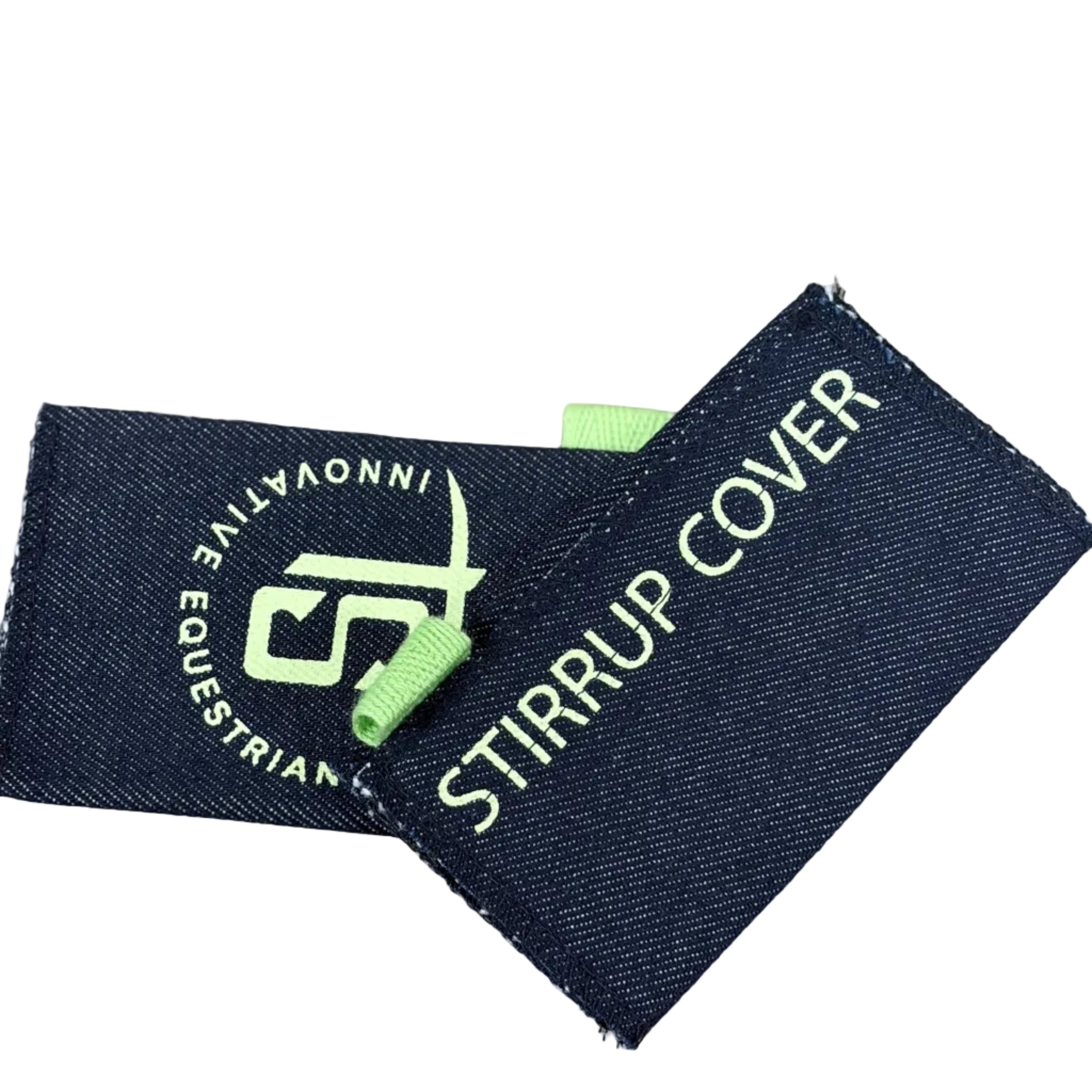 A dark navy blue denim stirrup cover with white embroidered text and logo, featuring a small lime green loop tab.