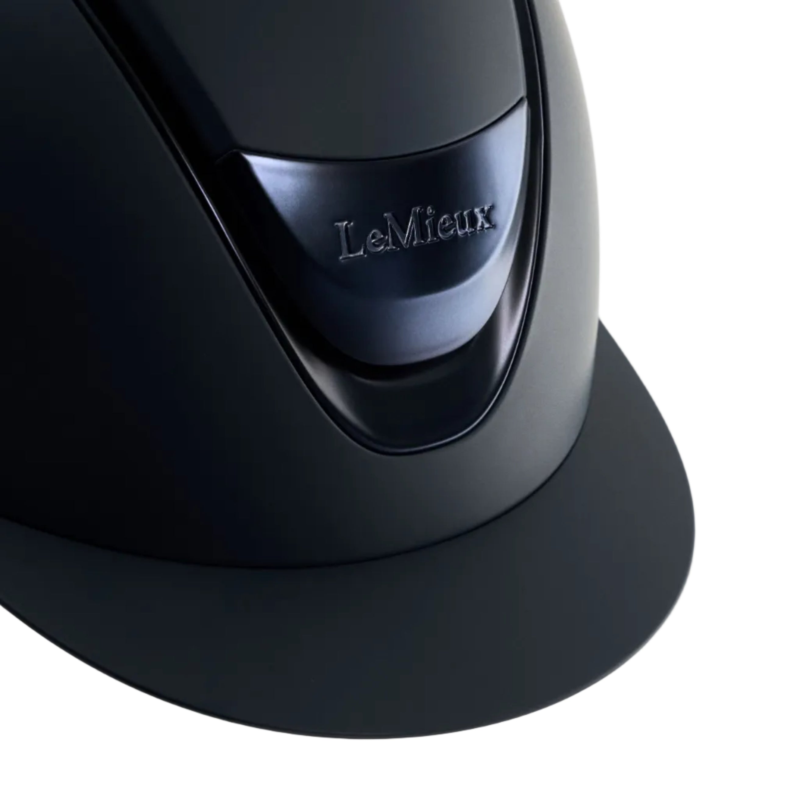 Close-up of a matte black LeMieux equestrian helmet with a glossy visor and the LeMieux logo on a light gray background.