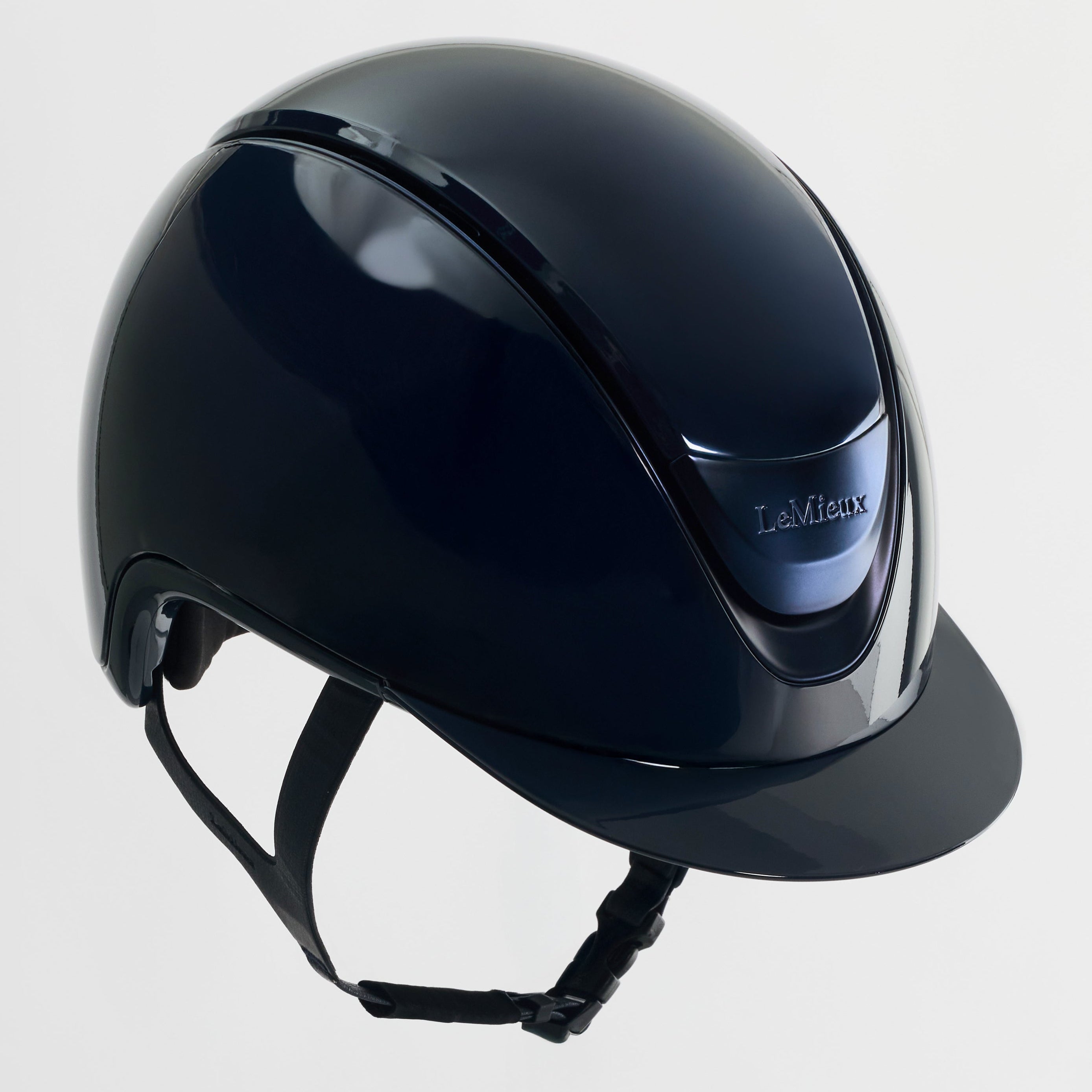 Black riding helmet on a light gray background