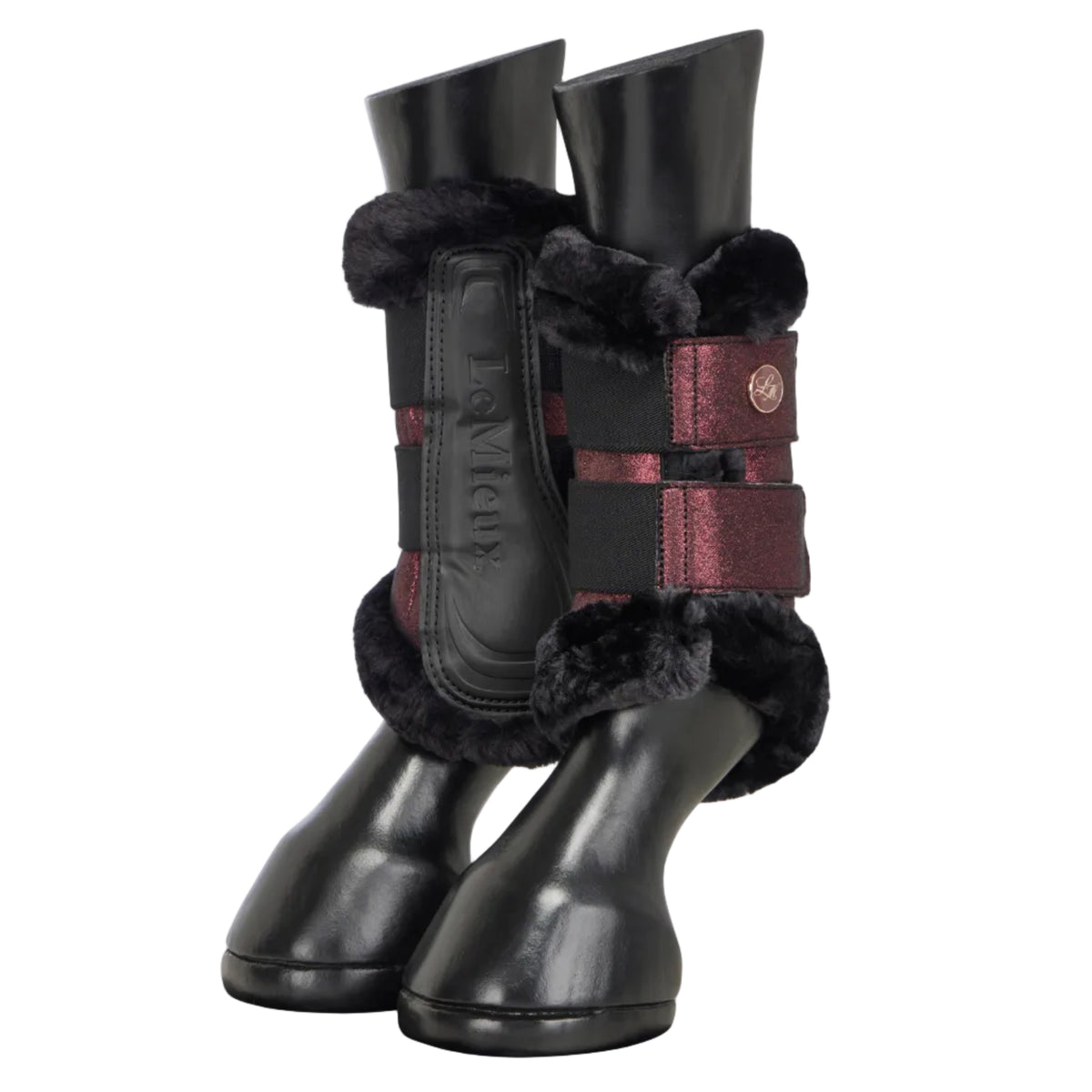 A pair of black leather horse boots with black faux-fur trim and burgundy straps, shown on a light gray background.