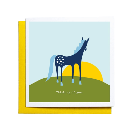 Thinking Of You Card - blue horse standing on green grass looking at yellow sunset