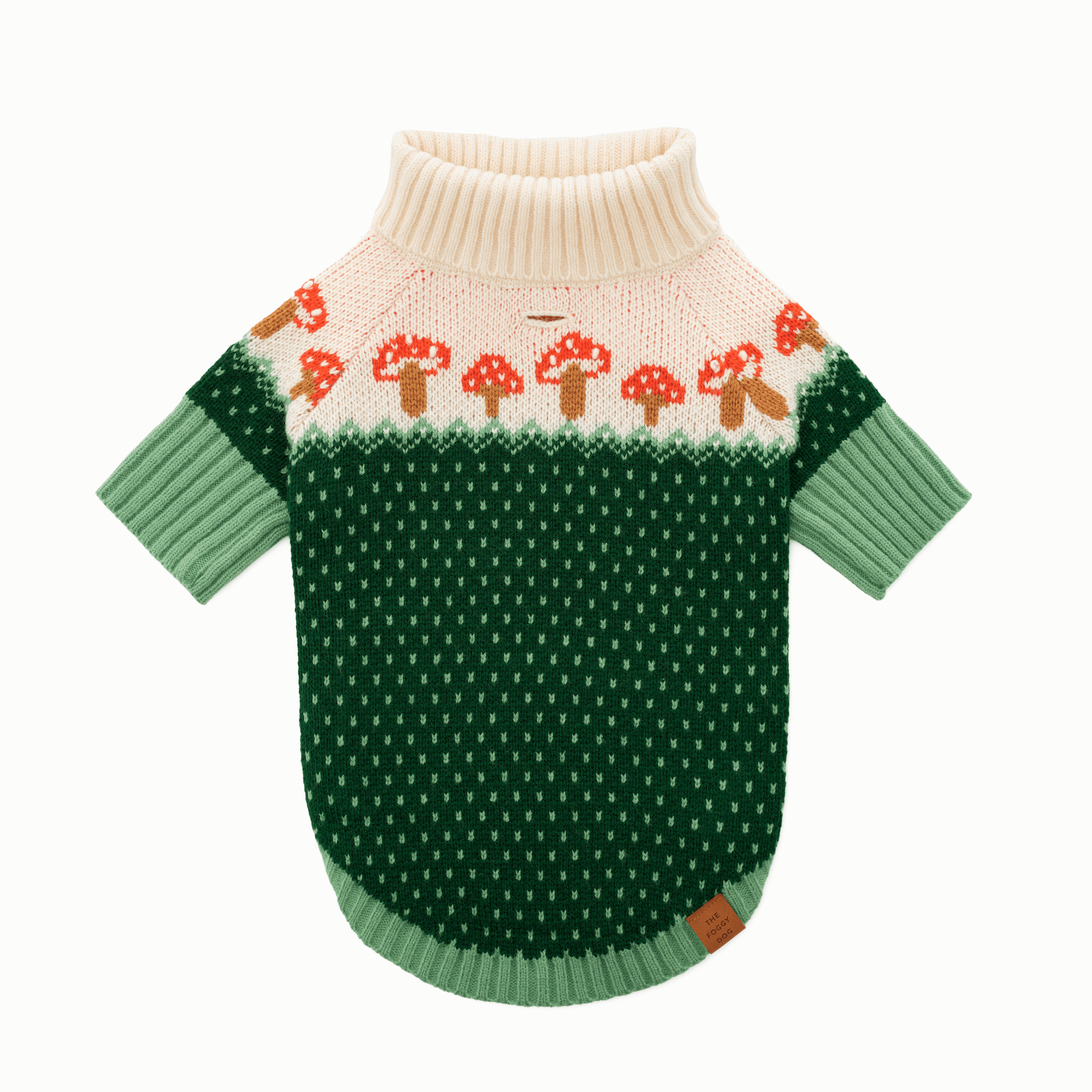 Green dog sweater with mushroom pattern on a white background