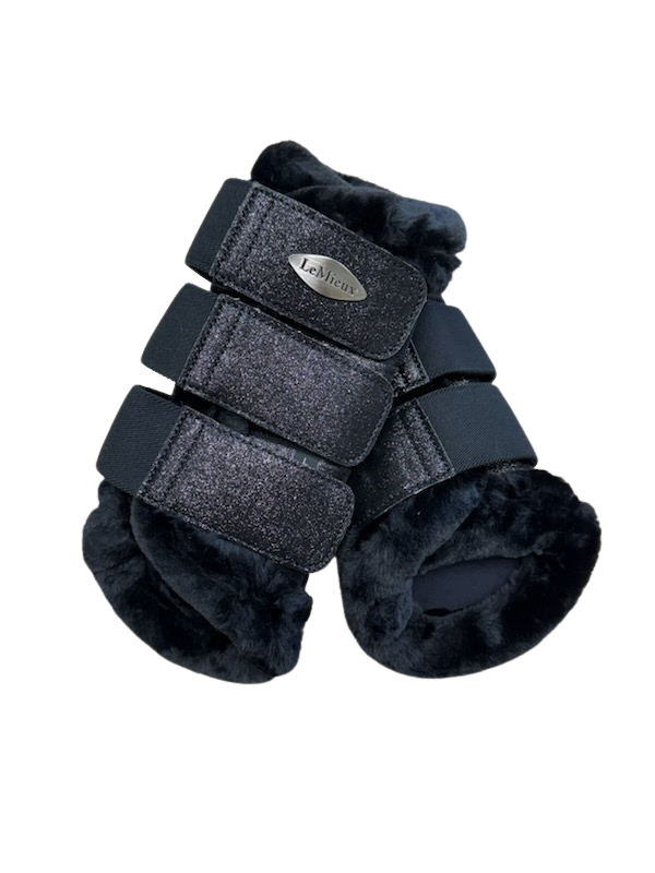 Pair of black horse leg wraps with visible brand logo on a white background