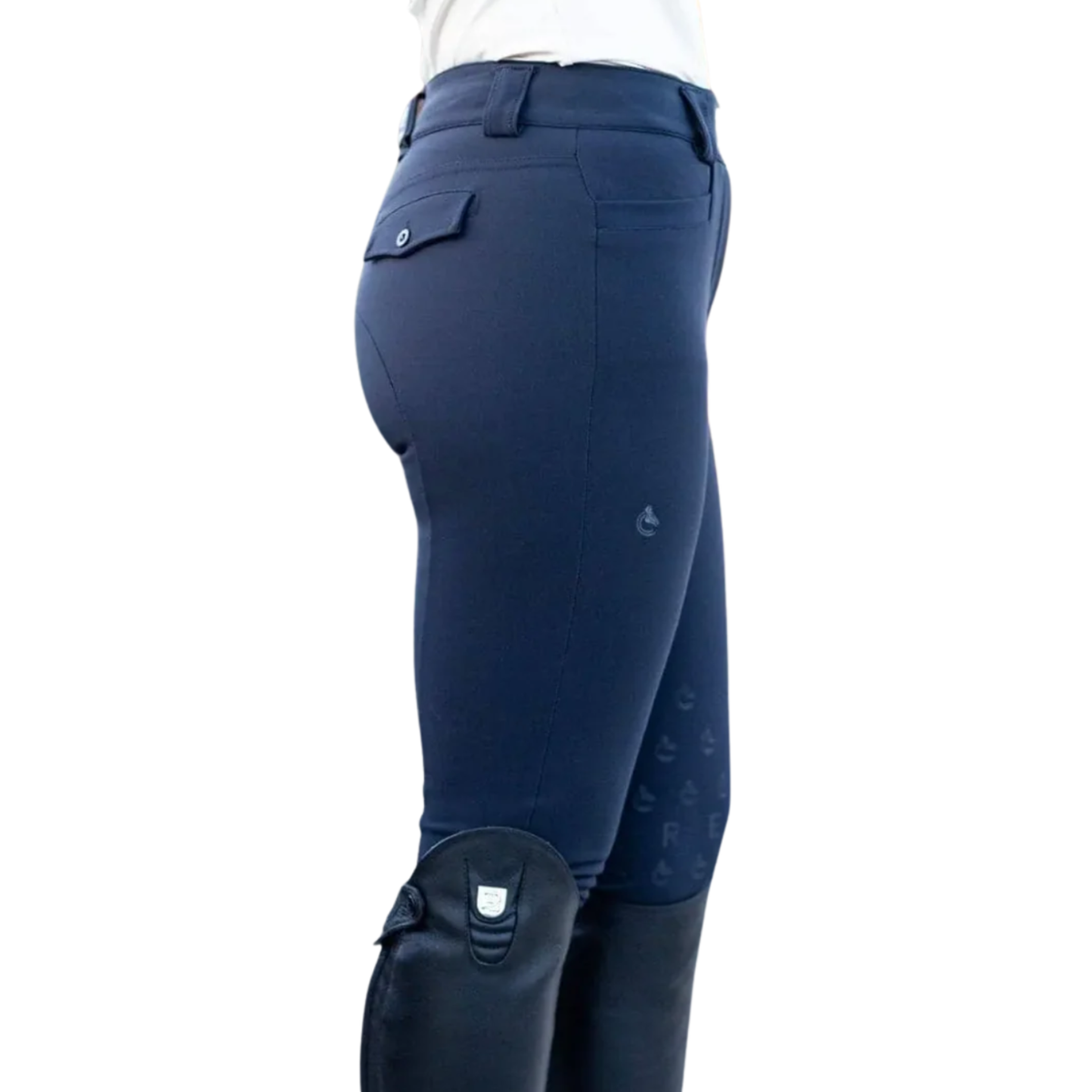 A side profile view of a person wearing navy blue equestrian riding breeches and black riding boots against a solid white background.