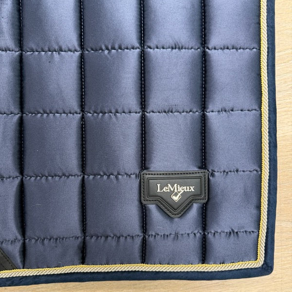 A close-up of a quilted navy blue