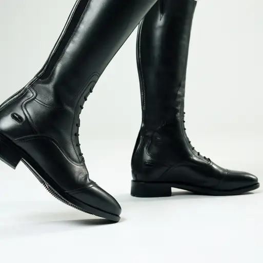 Black riding boots on a white background