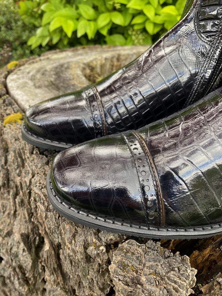 Patent croc foot with punched holes and parent brown rolled toe detailing