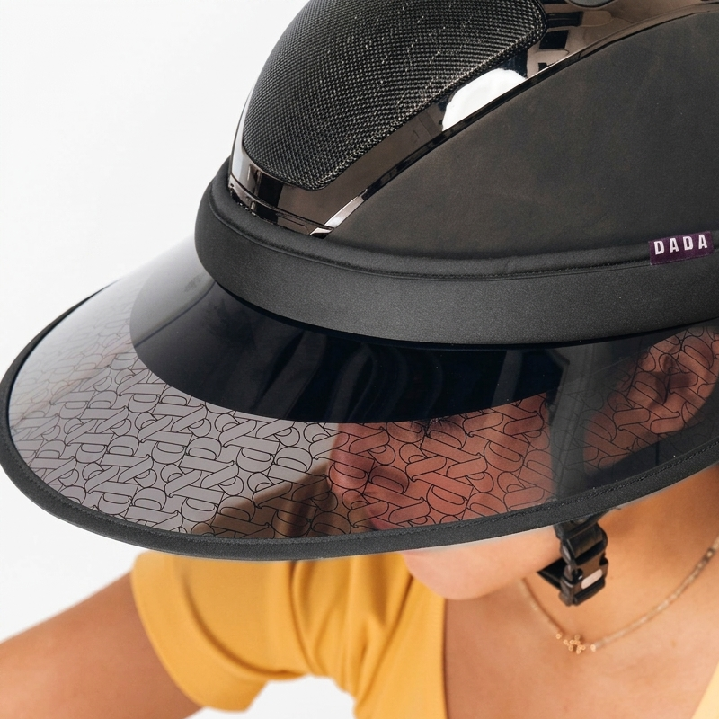 A close-up of a person wearing a black DADA visor