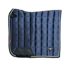 A navy blue quilted equestrian saddle pad with black leather panels and beige piping, 
