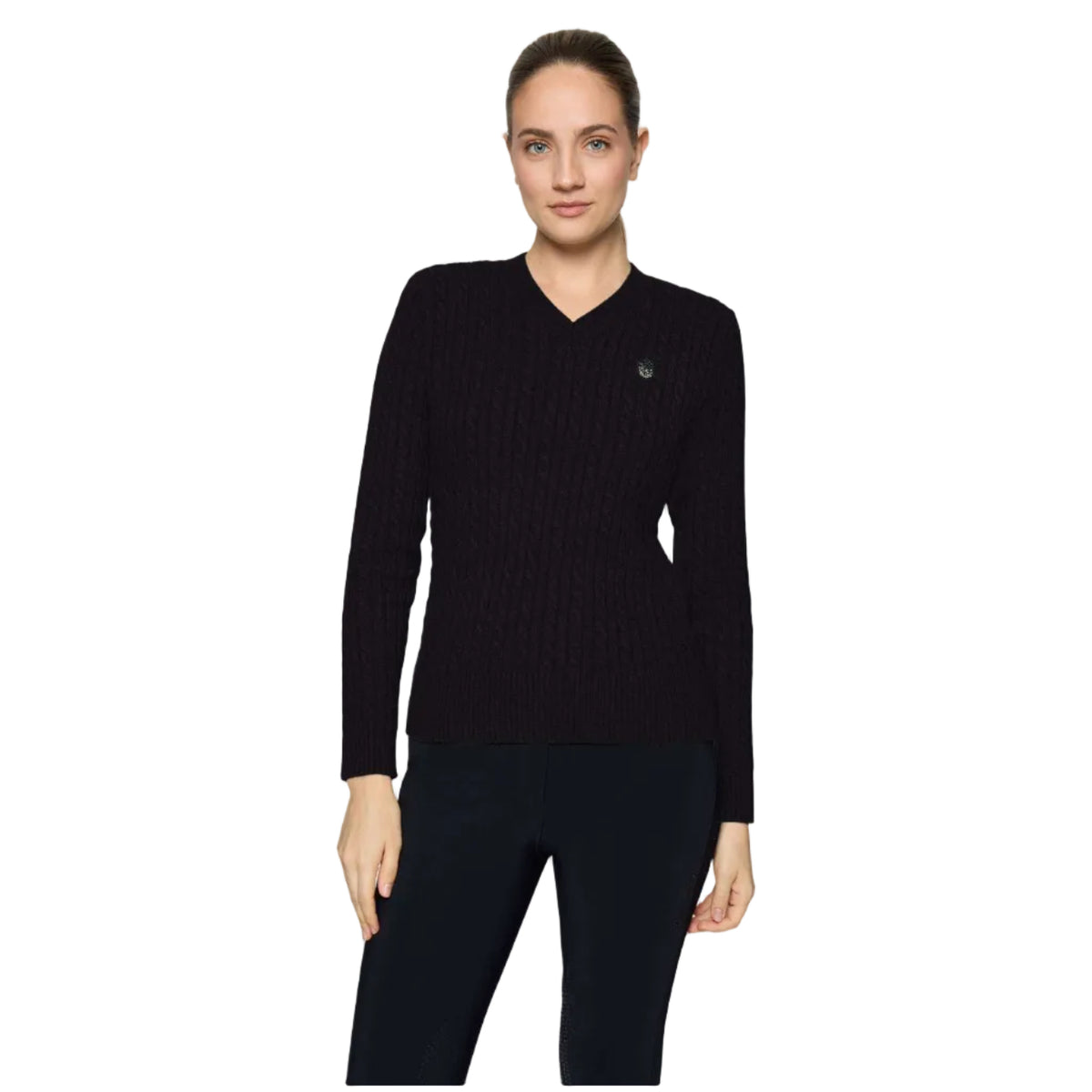 A woman modeling a black ribbed knit long-sleeve sweater with a V-neck and a small dark logo on the left chest, paired with dark leggings, against a light gray studio background.
