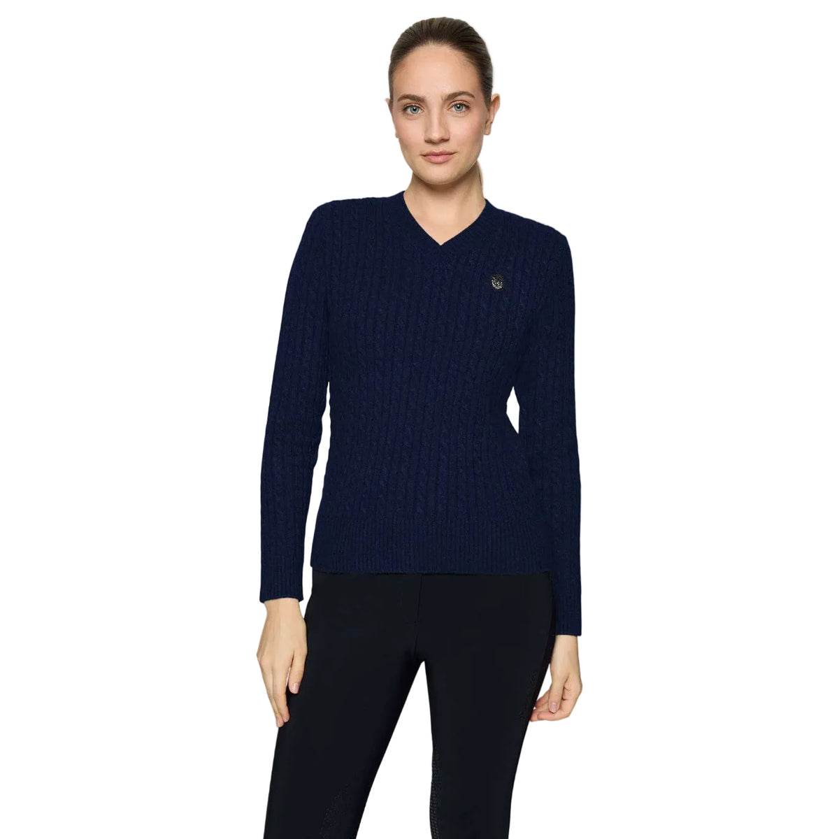 A woman modeling a navy blue ribbed V-neck sweater with a small embroidered logo on the left chest, paired with black leggings, against a light gray studio background.