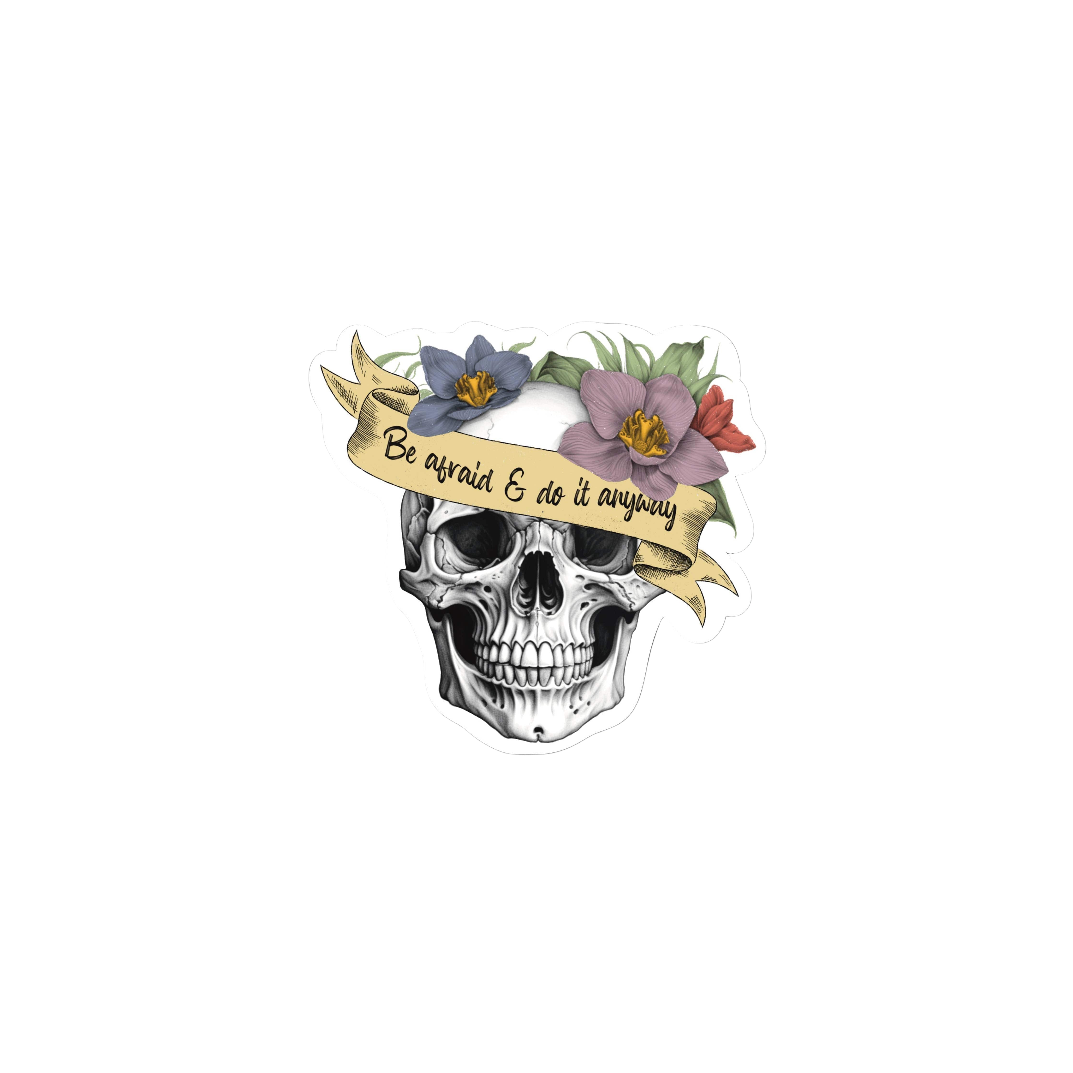 Sticker with a skull design, flowers, and a banner on a white background