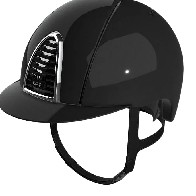 A glossy black equestrian riding helmet with a curved visor and black chin strap, shown on a light gray background. The brand name 'KEP' is visible on the front badge.