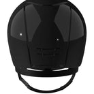 A black riding helmet facing away, with a white background.