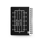 Black notebook with white line diagram and text on a white background