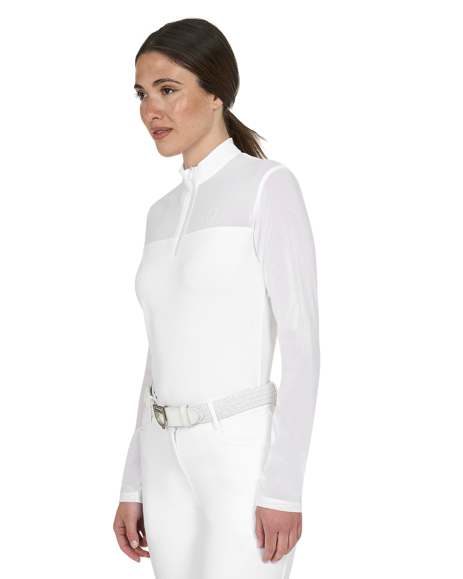 Woman wearing a white equestrian suit on a white background