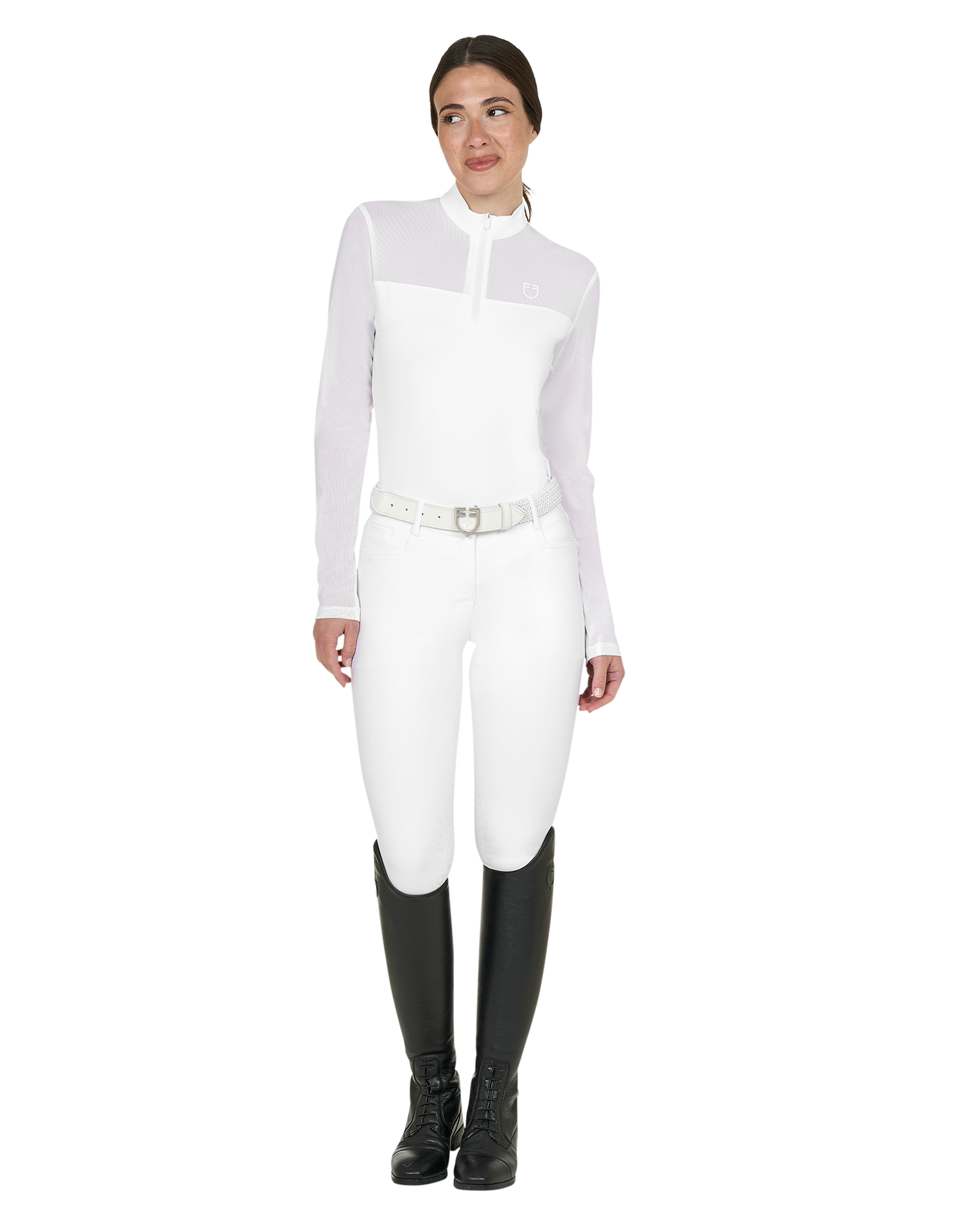 Person wearing a white equestrian suit with black boots on a white background