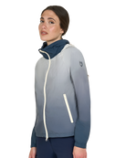 Woman wearing a gray and navy jacket on a white background