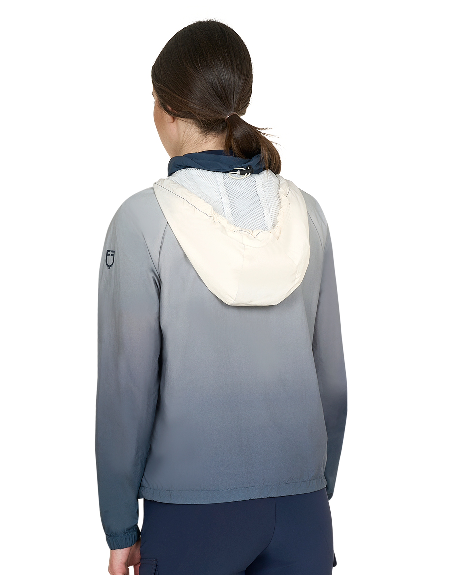 Person wearing a gray jacket with a white hood on a white background