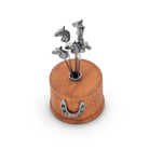 Wooden holder with metal horse figures on a white background