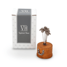 Vagabond House diffuser with wooden base and metal accents on a white background