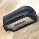 Black toiletry bag with 'Olson's' branding