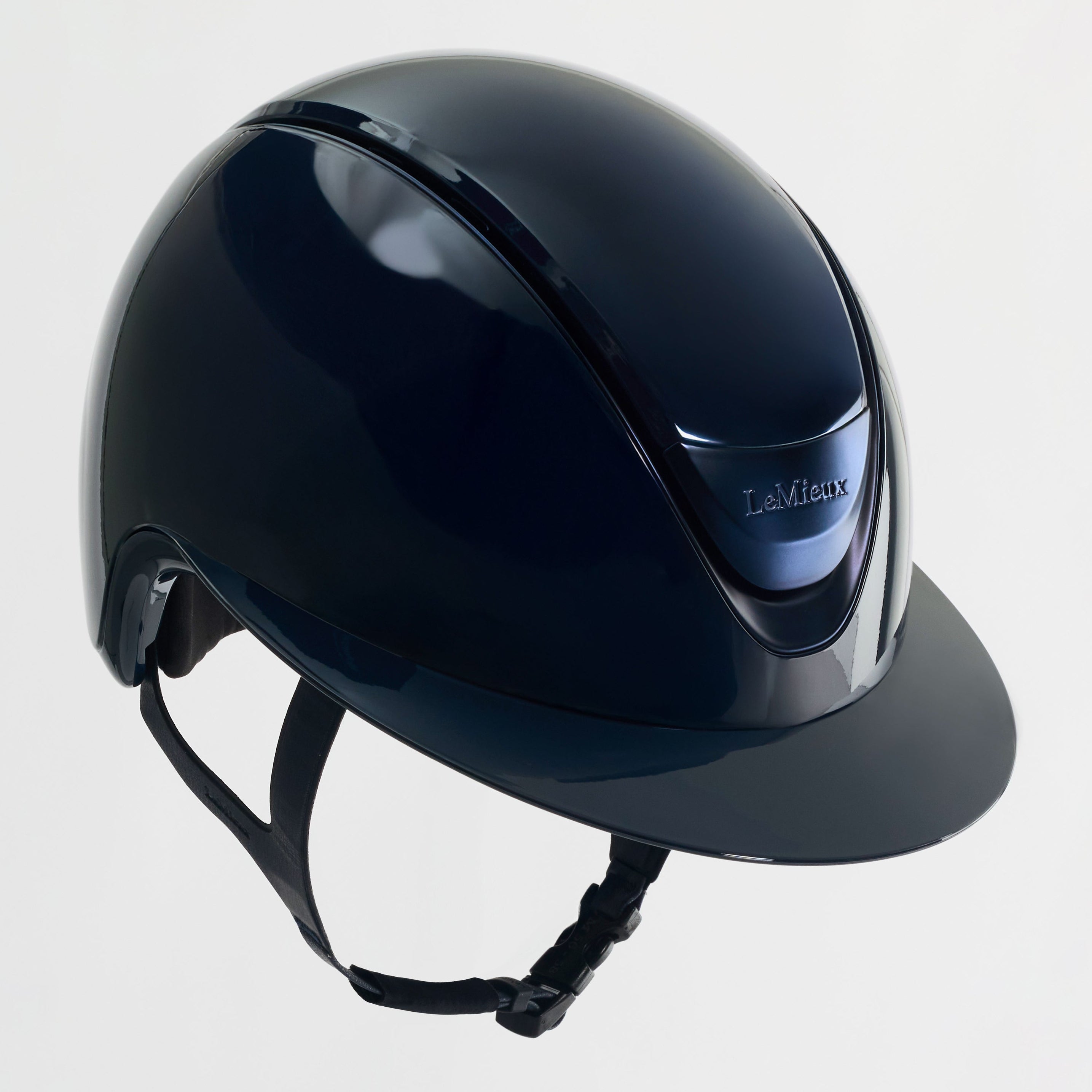 Black riding helmet on a light gray background