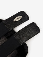 Black equestrian girth with LeMieux logo on a white background