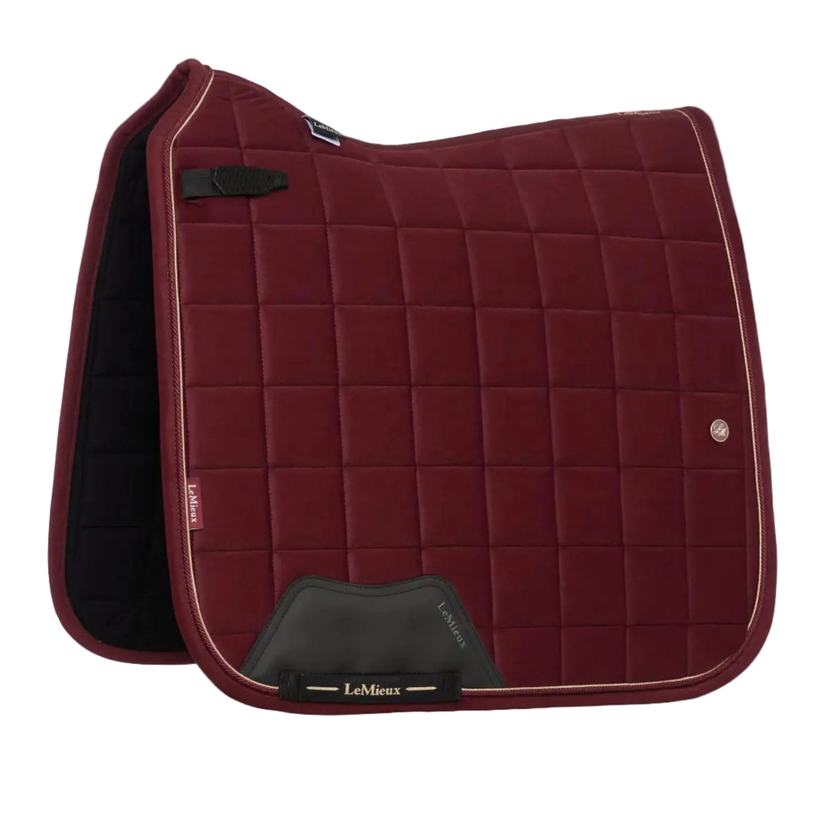 A LeMieux equestrian saddle pad in deep burgundy with a quilted grid pattern, cream piping, and black protective leather accents, shown on a light gray background.