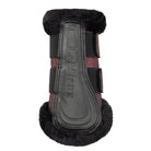 A single LeMieux horse boot shown from the front on a light gray background. The boot features a black faux-leather center with the brand name embossed, black velcro straps, and dark brown or black faux-fur trim at the top and bottom.