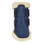 A navy blue leather horse boot with cream-colored shearling lining on the top and bottom, featuring adjustable navy straps and the embossed brand name 'LeMieux' on the front.