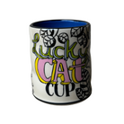 Ceramic mug with 'Lucky Cat Cup' text and colorful design on a plain background