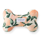 Bone-shaped dog toy with peach and leaf pattern and 'The Foggy Dog' label on a white background