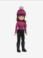 A doll with long red hair wearing a magenta riding helmet with a pom-pom, a matching magenta long-sleeve top, black riding pants, and black riding boots, shown against a plain light gray background.