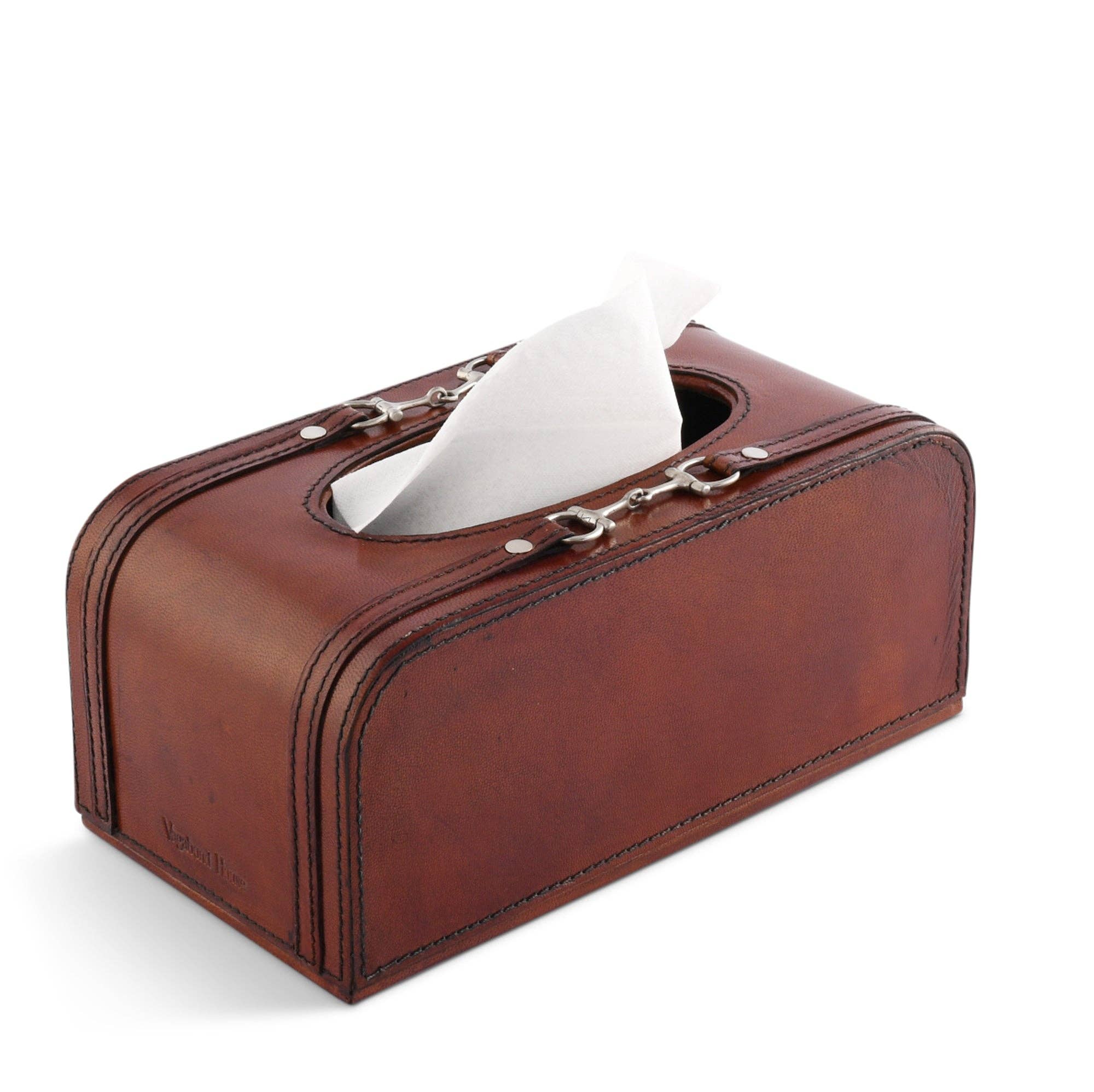 Brown leather tissue box with white tissues on a white background