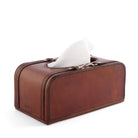 Brown leather tissue box with tissues on a white background