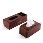 Brown leather tissue box with compartments on a white background
