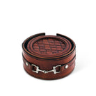 Brown leather coaster set with woven pattern and metal bit buckle on a white background