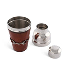 Metallic cup with leather wrap and two silver lids on a white background