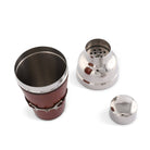 Metallic shaker with leather wrap on a white background
