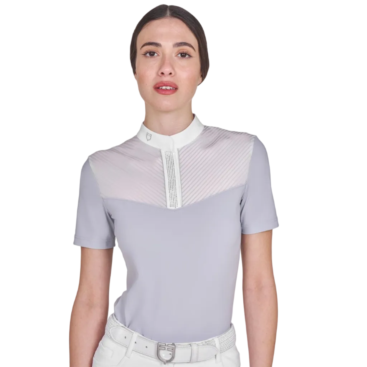 Woman wearing a light gray equestrian shirt with white accents on a white background