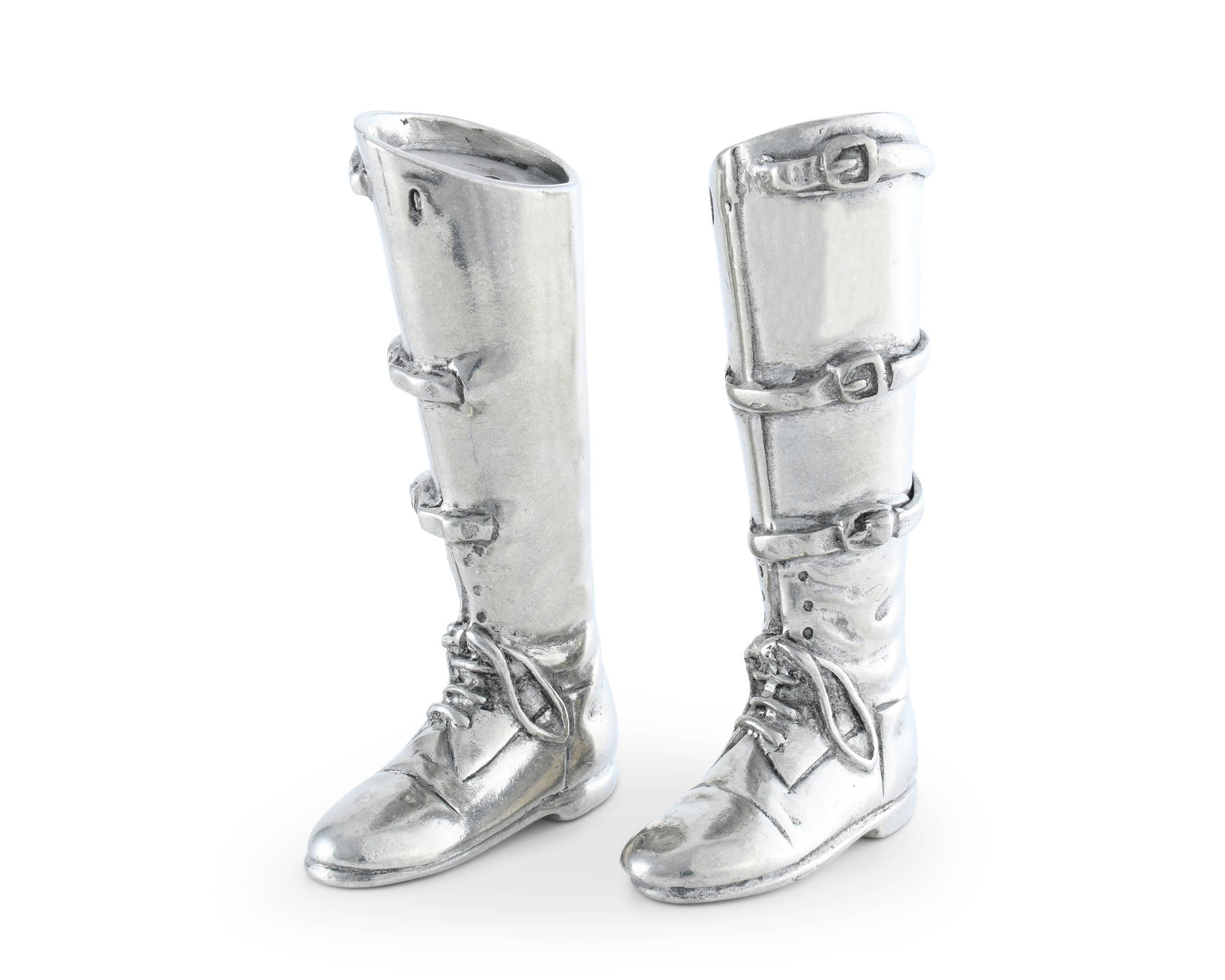 Pair of silver knee-high boots with buckles on a white background