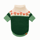Green dog sweater with mushroom pattern on a white background