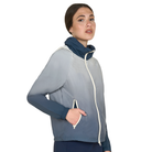 Woman wearing a gray and blue jacket with a white zipper on a white background