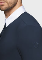 Navy suit jacket with white shirt collar on a plain background