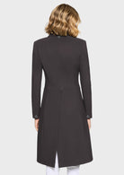 Black coat worn by a person on a white background