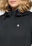Close-up of a black jacket with a brand logo on a white background