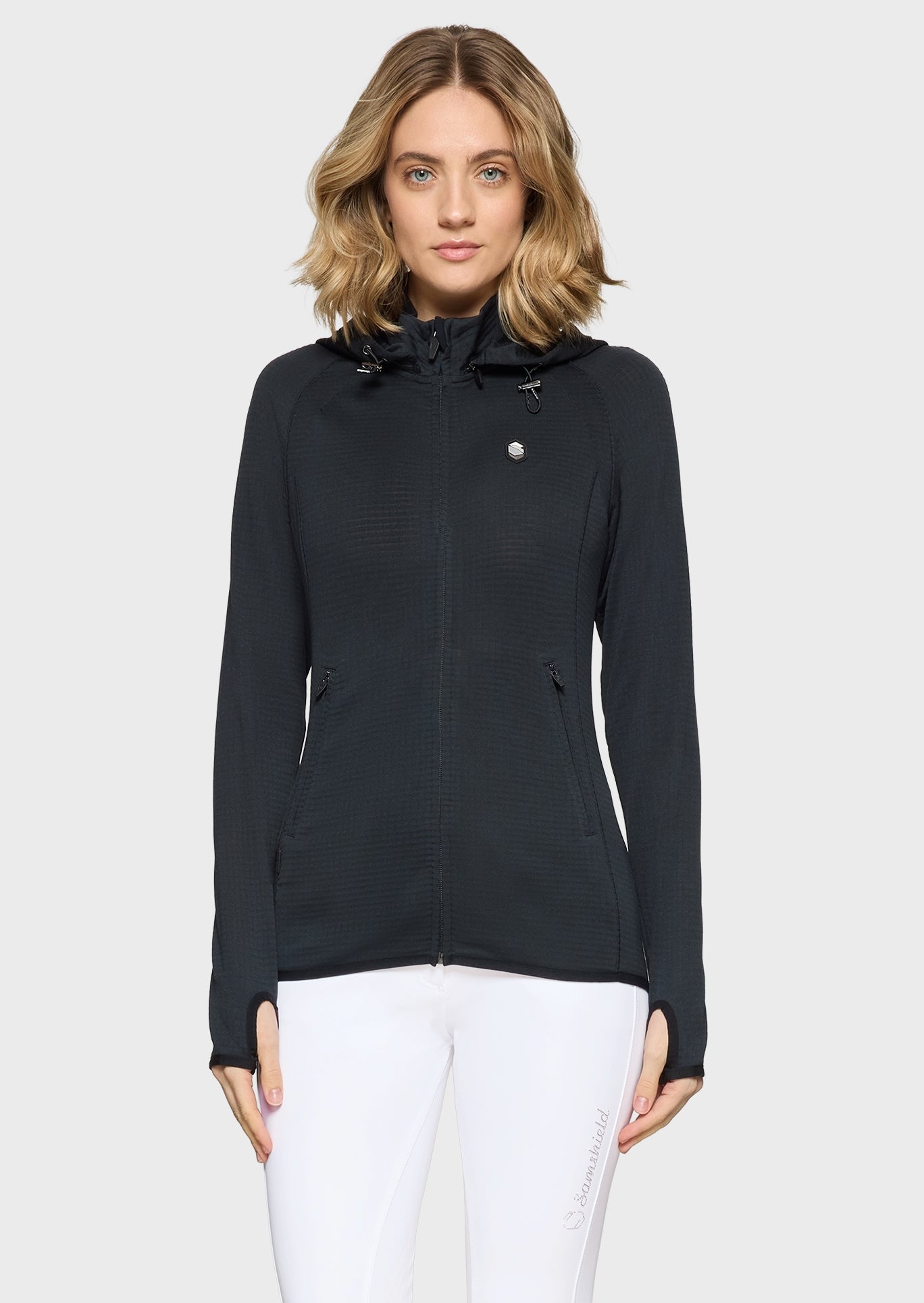 Woman wearing a black jacket on a white background