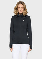 Woman wearing a black jacket on a white background